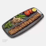 خوراک کباب لقمه زعفرانی - یک سیخ کباب لقمه زعفرانی گوشت گوسفندی 300 گرمی، دورچین: فلفل...